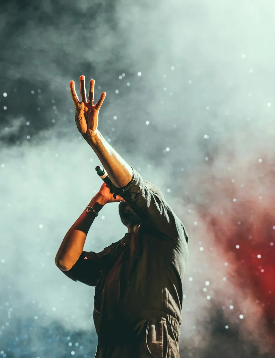 Vocalist performing on a smoke-filled stage